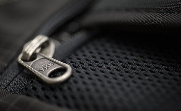 A close shot of the backpack compartment zipper.